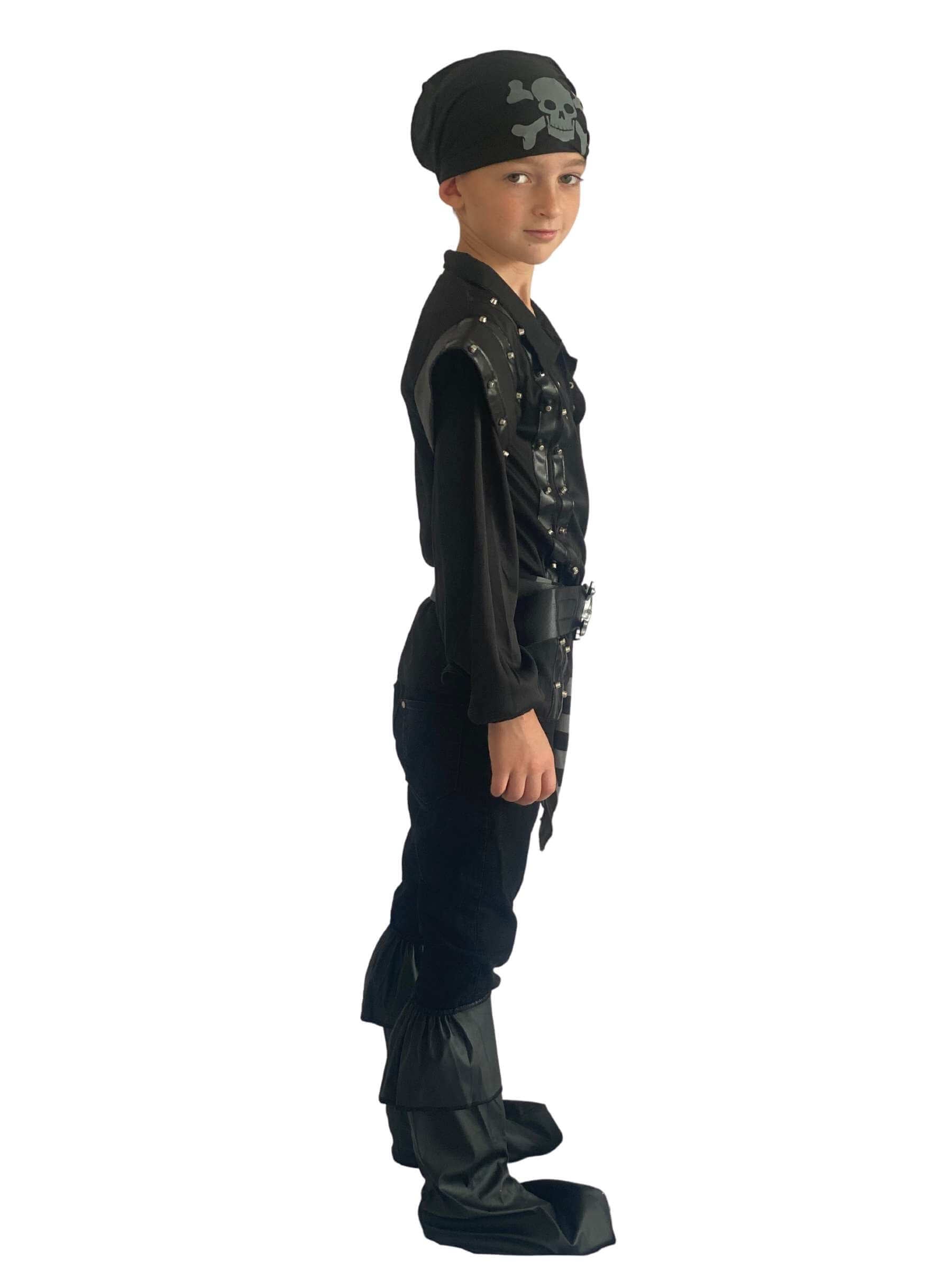 Boy wearing a black pirate costume standing side ways showing the boot covers.