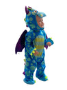Toddler wearing a blue and green spotty dragon costume with purple wings and padded dragon face hood.
