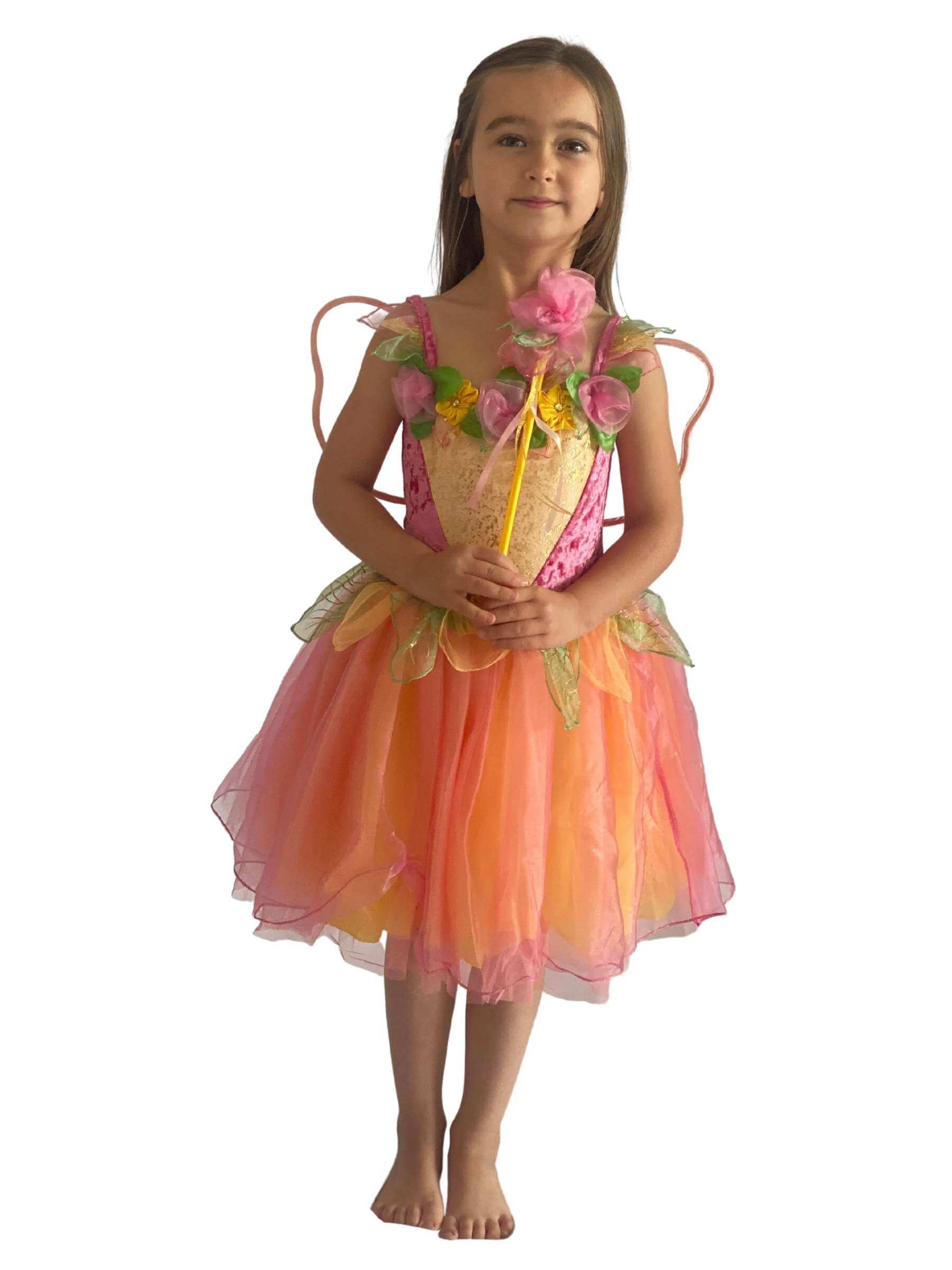 Girl wearing a pink and yellow fairy costume holding a wand.