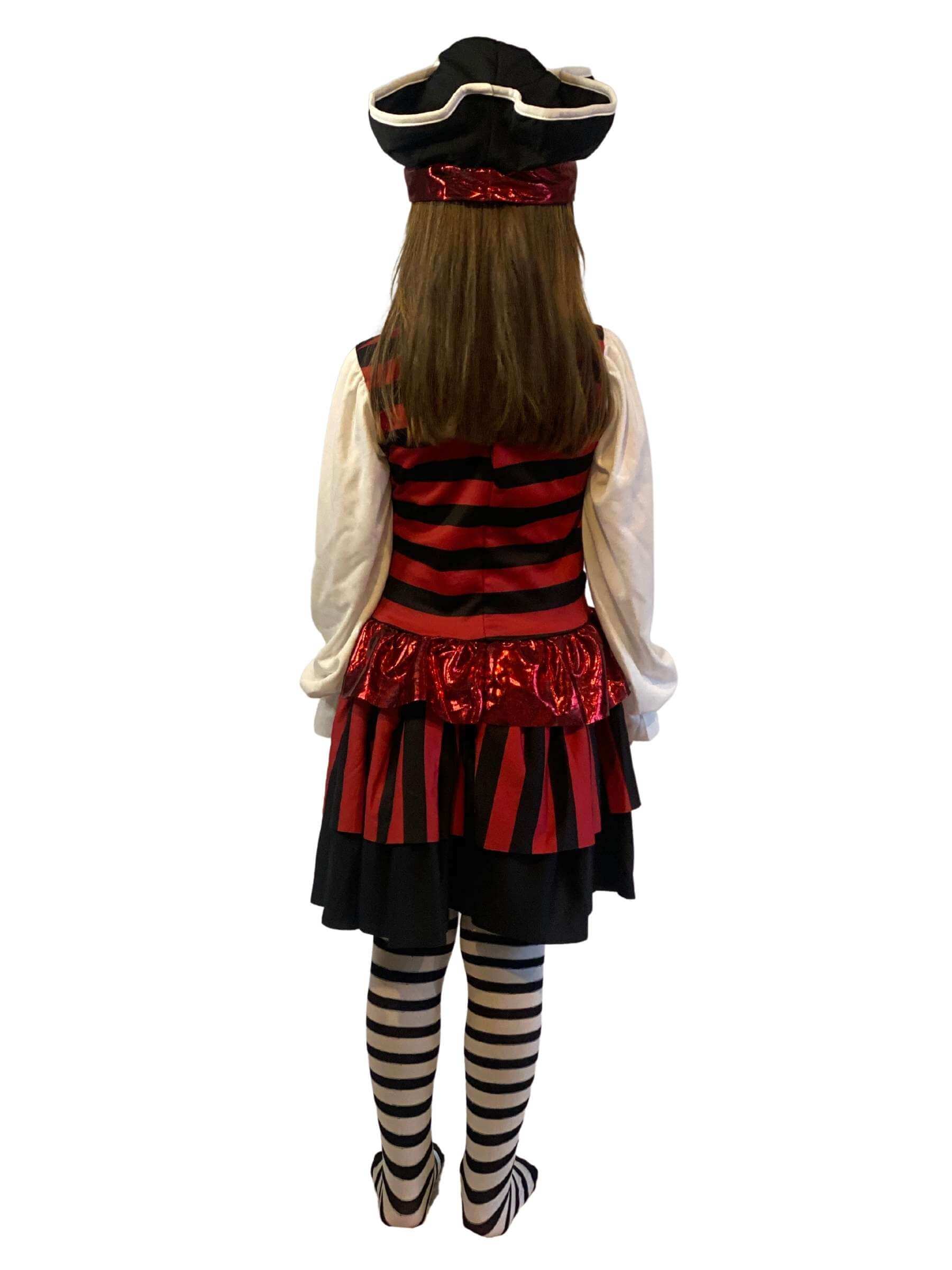 Showing the back of a girl wearing a black and red striped pirate dress with black and white tight and a fabric pirate hat.