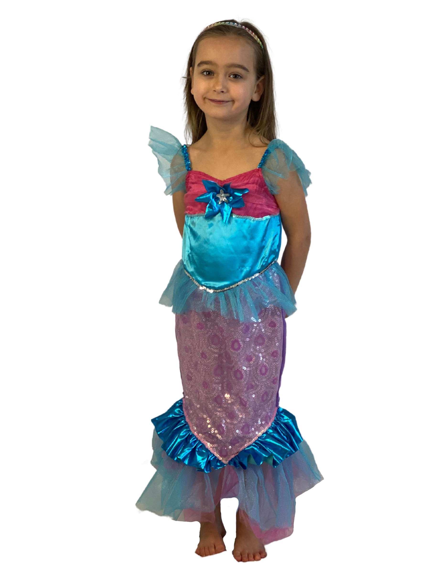 Girl wearing a blue and pink mermaid dress in fishtail style. 