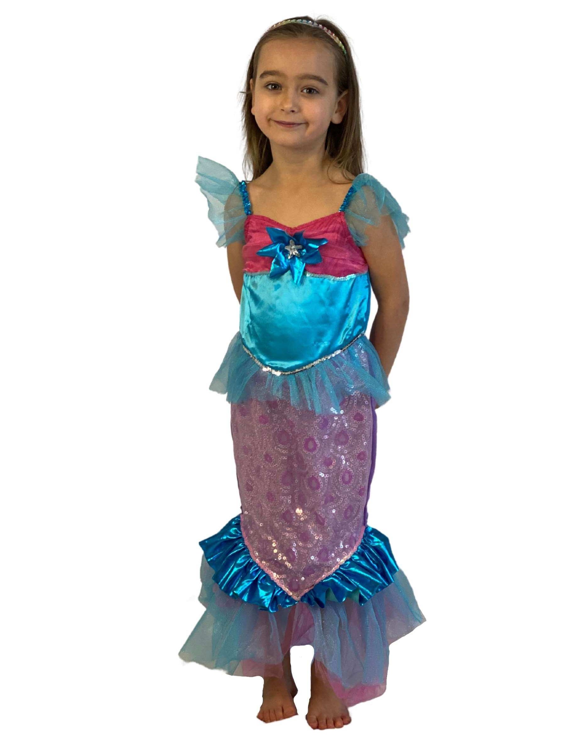 Girl wearing a blue and pink mermaid dress in fishtail style. 