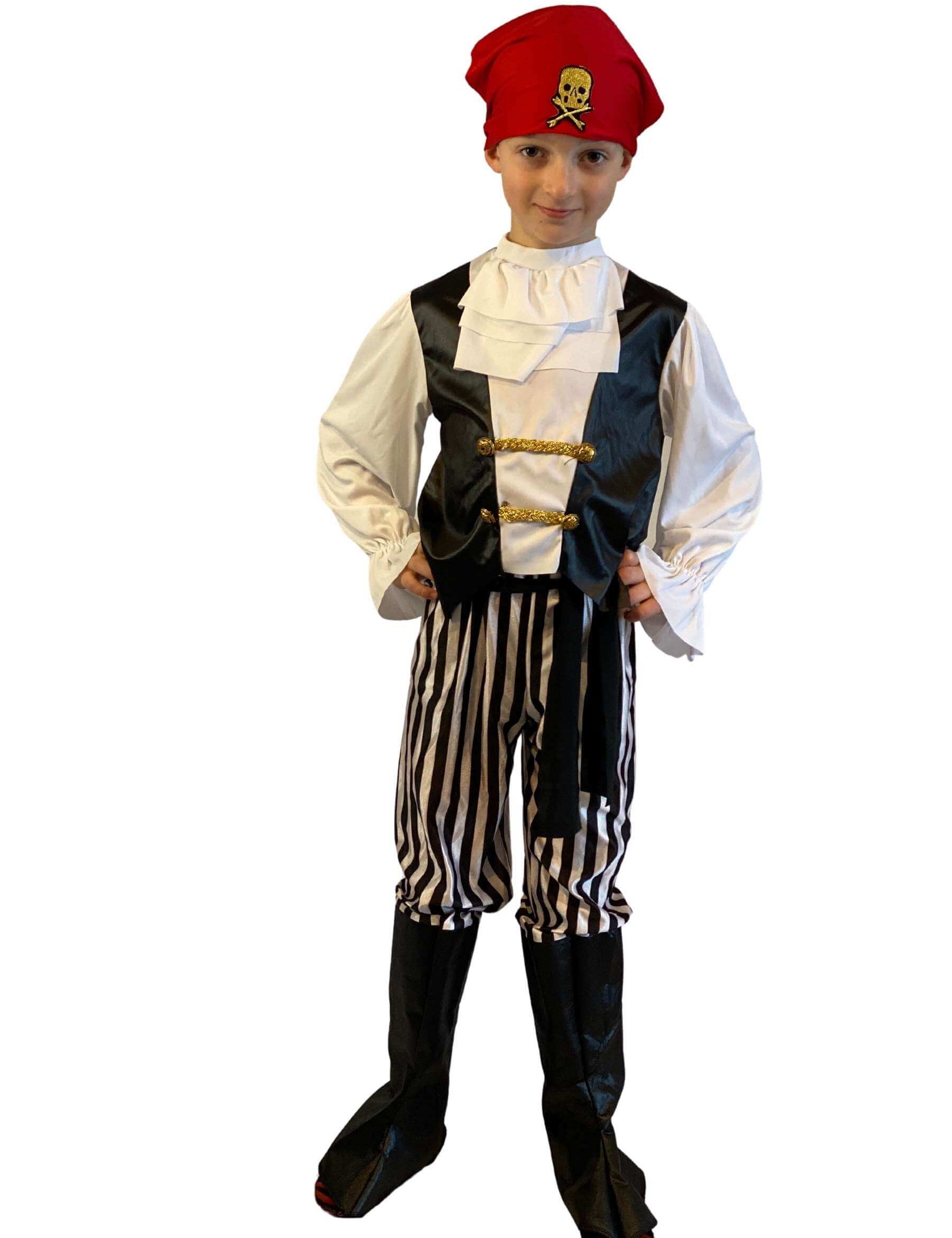 Boy wearing a black and white pirate costume with ruffled neck, black and white vertical striped trousers with attached boot covers and a red bandana.
